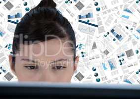 Close up of woman at computer against document backdrop