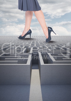 Woman walking on a maze against a sky with clouds 3d