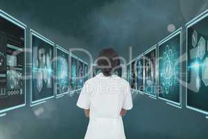 Woman doctor looking at 3d medical interfaces