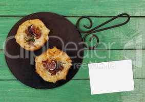 Bussiness card on green wooden desk with food and copy space