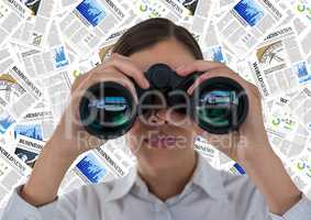 Close up of business woman with binoculars against document backdrop