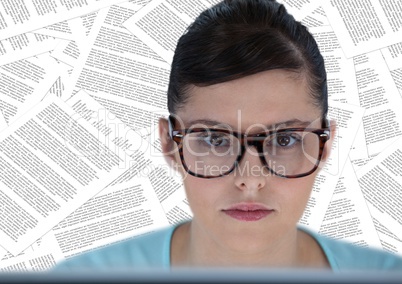 Close up of woman at computer against documents backdrop