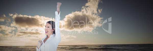 Business woman celebrating against water and sunset 3d