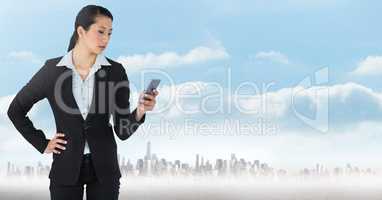 businesswoman with phones in cityscape