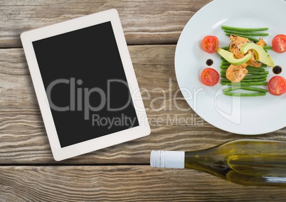 Tablet on wooden desk with food 3d