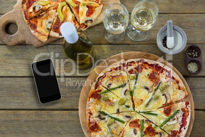 Phone on wooden desk with food