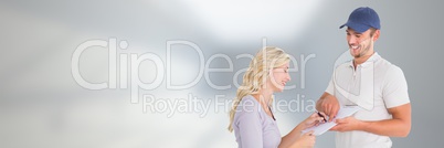 Delivery Courier with client signing forms  in front of blurred copy space background