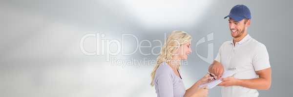 Delivery Courier with client signing forms  in front of blurred copy space background