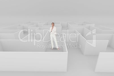 Happy woman standing in a 3d maze