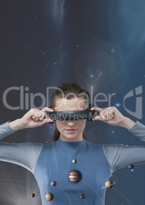 Woman in VR headset looking to 3D planets against blue background with stars and flares