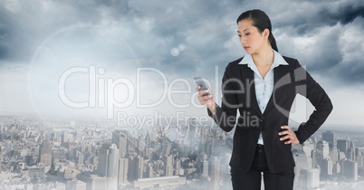 businesswoman on phone in cityscape