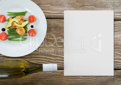 Blank card on wooden desk with food and copy space on a paper