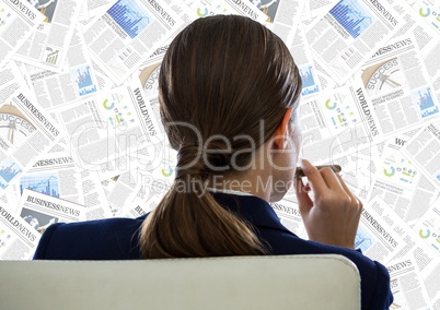 Back of business woman in chair looking at document backdrop