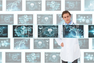 Man doctor interacting with 3d medical interfaces against white background with medical interfaces