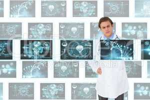 Man doctor interacting with 3d medical interfaces against white background with medical interfaces