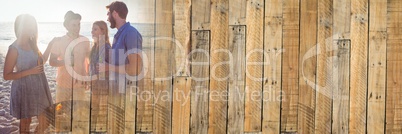 Millennials at bbq on beach with flare and wood panel transition