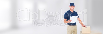 Delivery Courier with box and form in front of blurred background with white copy space