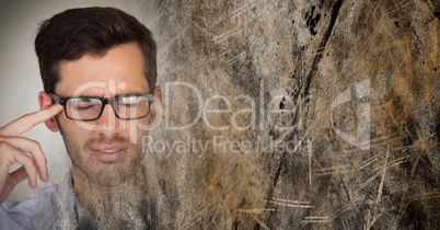 Portraiture of frustrated man with glasses and brown grunge transition