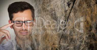 Portraiture of frustrated man with glasses and brown grunge transition