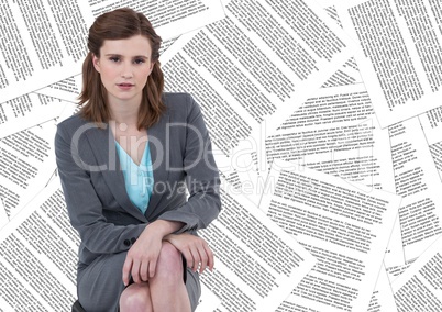 Business woman sitting against document backdrop