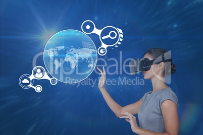 Woman in VR headset touching interface against blue background with flares