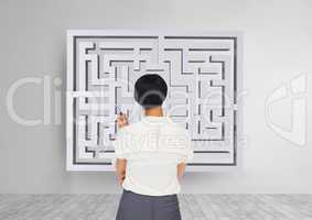 Woman looking to a maze on the wall 3d