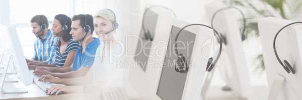 Customer service assistants  with headsets with bright computer background
