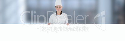 Chef holding blank sign with blurred background