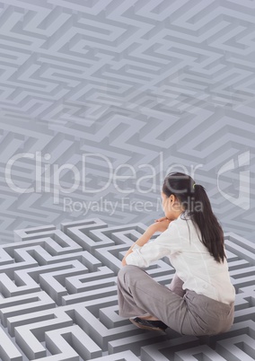 Woman sitting on a 3d maze against background with mazes