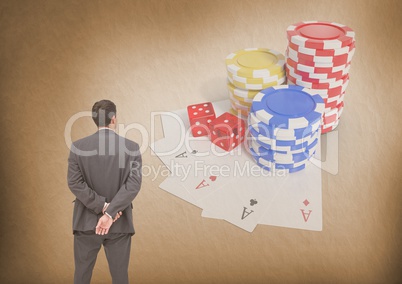 Back of Man Looking at casino 3d poker chips and playing cards