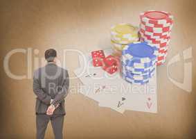 Back of Man Looking at casino 3d poker chips and playing cards