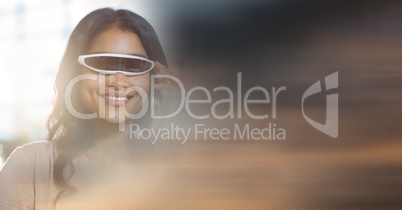 Close up of woman smiling in virtual reality headset and blurry sunset transition 3d