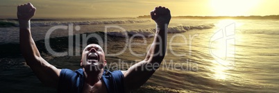 Athlete celebrating against waves and sunset 3d