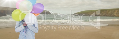 Woman mid section with balloons on beach with flare 3d