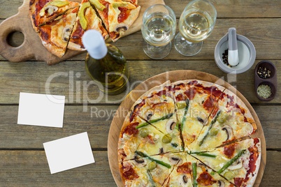 Blank cards on wooden desk with food and copy space on card