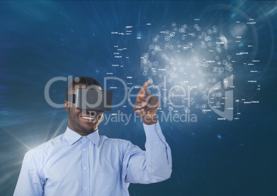 Happy man in VR headset touching interface with flares against blue background