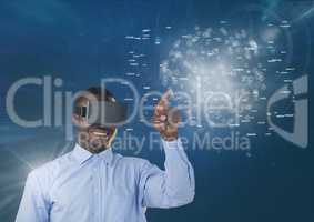 Happy man in VR headset touching interface with flares against blue background