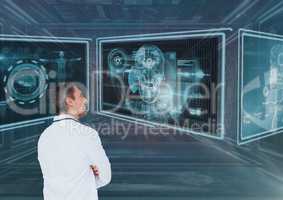 Man doctor looking at 3d medical interfaces