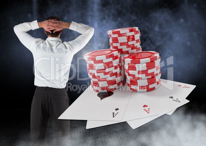 Back of Man with casino 3d poker chips and playing cards