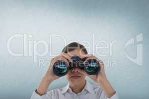 Woman looking through binoculars against white background