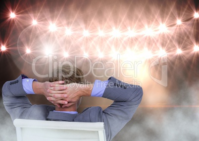 Seated man relaxed with flood lights