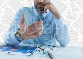 Business man at desk with glass device against document backdrop