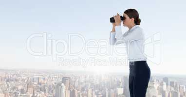 Woman with binoculars in city
