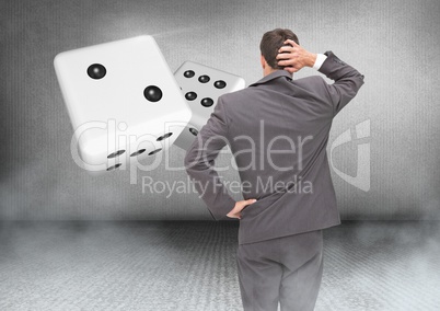 Back of Man Looking at 3d pair of dice