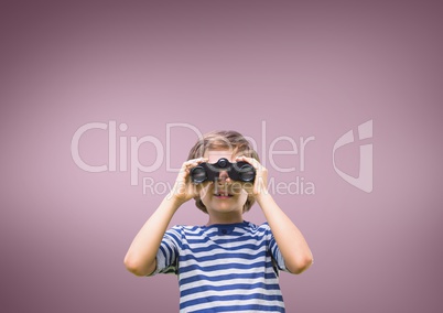 Boy looking through binoculars against pink background