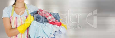 Cleaner holding laundry basket  with bright background