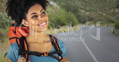 Close up of millennial backpacker against road