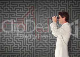 Man looking through binoculars against 3d maze background