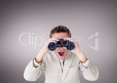 Surprised man looking through binoculars against purple background
