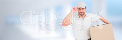 Delivery Courier holding box in front of blurred background and copy space